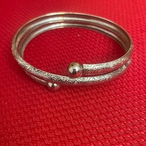 Silver tone bangle.